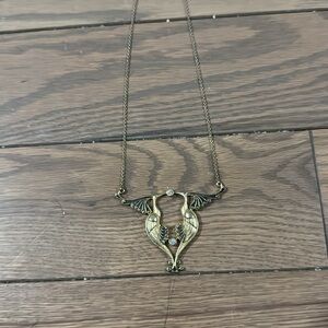 Vintage MMA jewelry. Beautiful two peacocks kissing over cz circle cut stone.